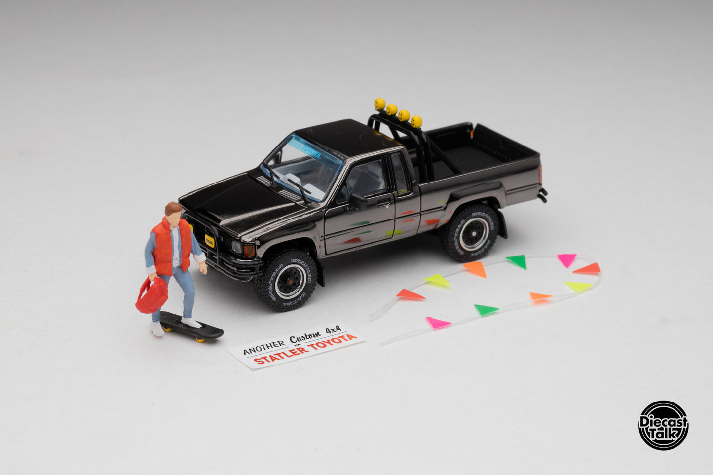 DiecastTalk MDX Exclusive 1/64 Toyota 1985 Hilux SR5 4x4 Black Chrome
