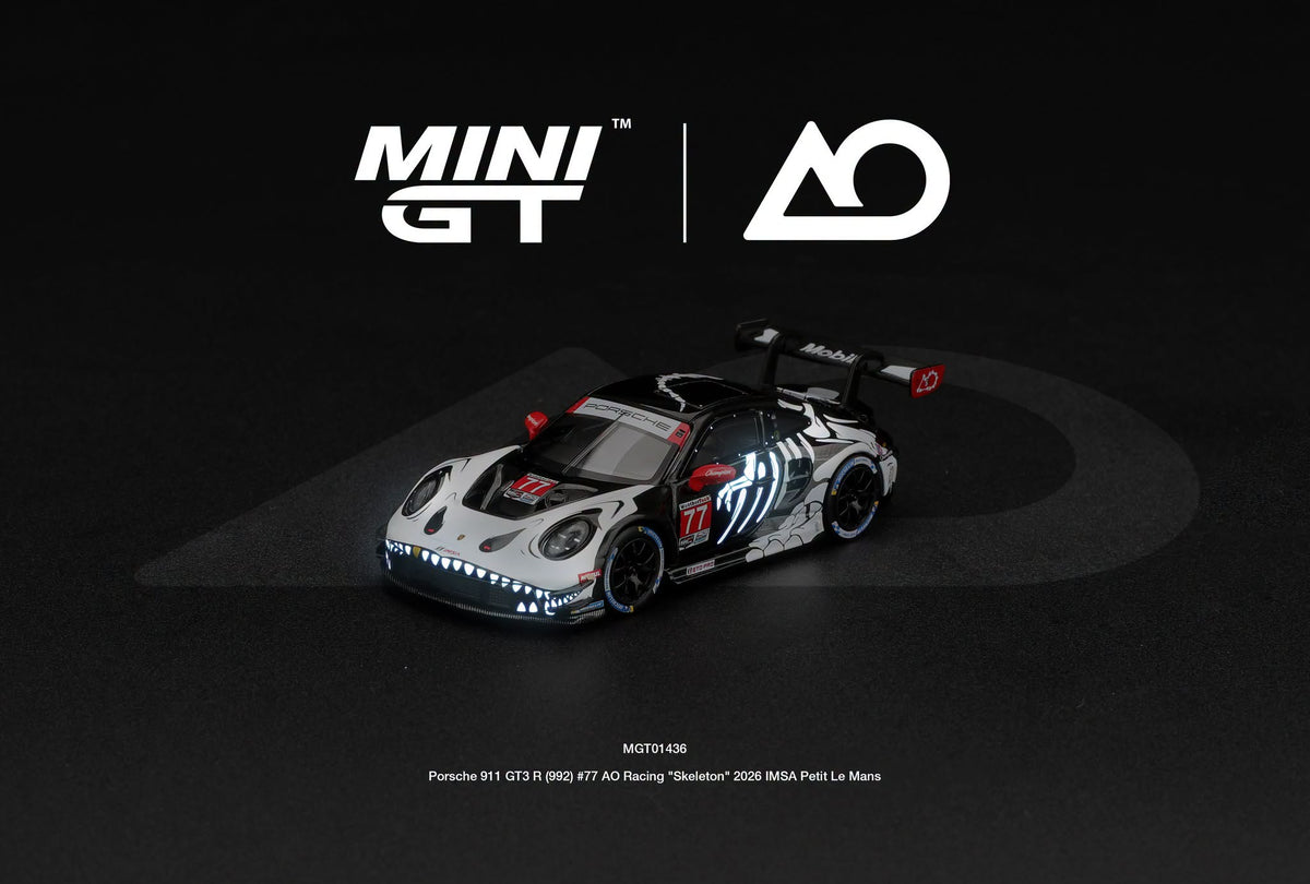 Mini GT 1:64 Porsche 911 GT3 R (992) #77 AO Racing "Skeleton Rexy" 2026 IMSA Petit Le Mans