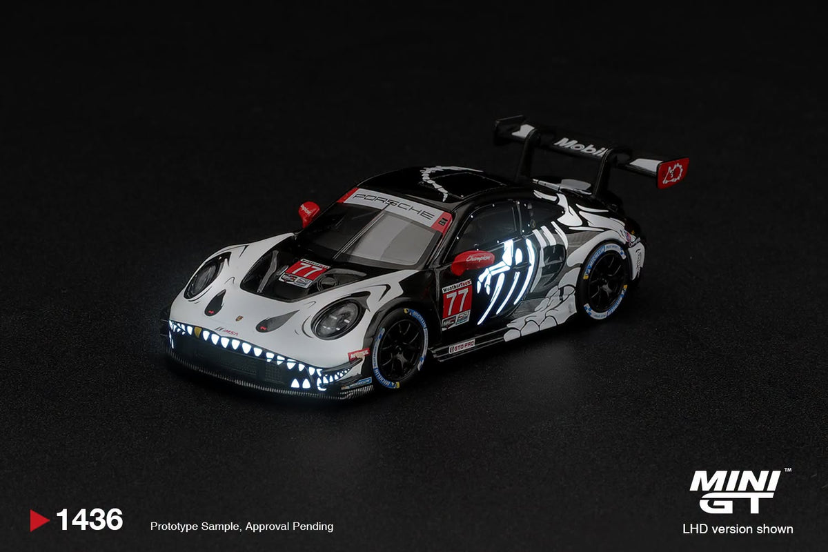 Mini GT 1:64 Porsche 911 GT3 R (992) #77 AO Racing "Skeleton Rexy" 2026 IMSA Petit Le Mans