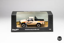 Load image into Gallery viewer, HUF x DiecastTalk 1/64 Toyota Hilux SR5 4x4 with skateboard