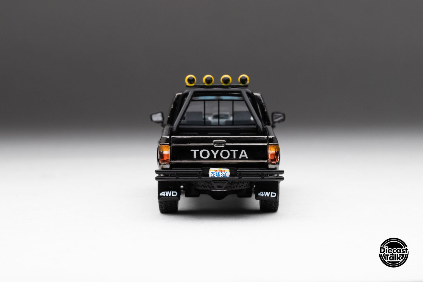 DiecastTalk MDX Exclusive 1/64 Toyota 1985 Hilux SR5 4x4 Black Chrome