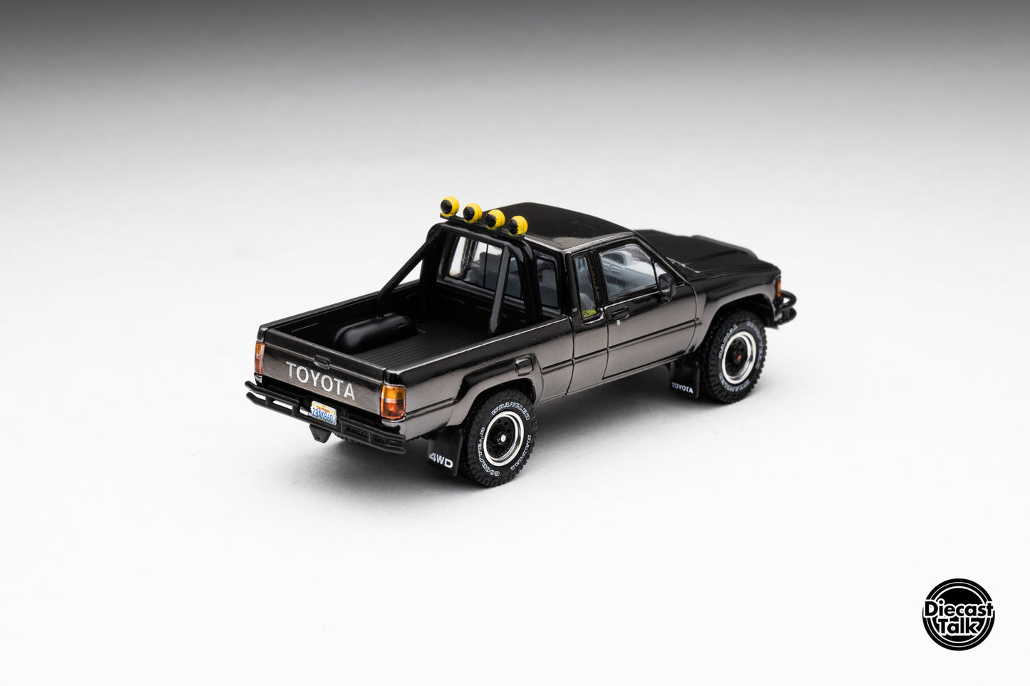 DiecastTalk MDX Exclusive 1/64 Toyota 1985 Hilux SR5 4x4 Black Chrome