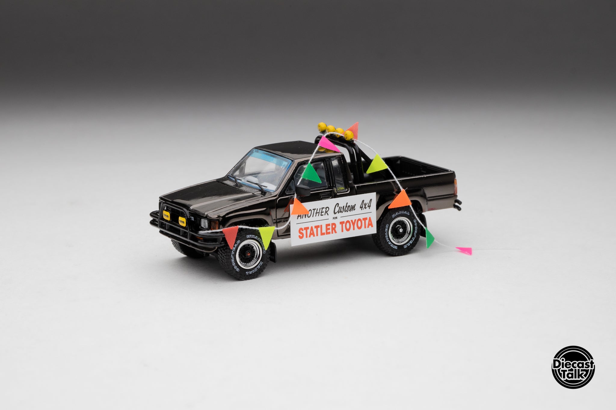 DiecastTalk MDX Exclusive 1/64 Toyota 1985 Hilux SR5 4x4 Black Chrome