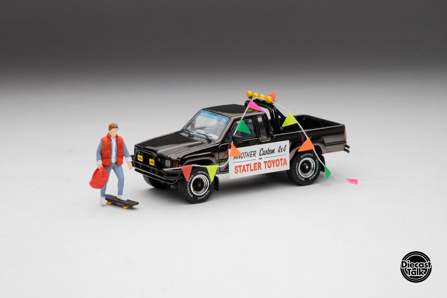 DiecastTalk MDX Exclusive 1/64 Toyota 1985 Hilux SR5 4x4 Black Chrome