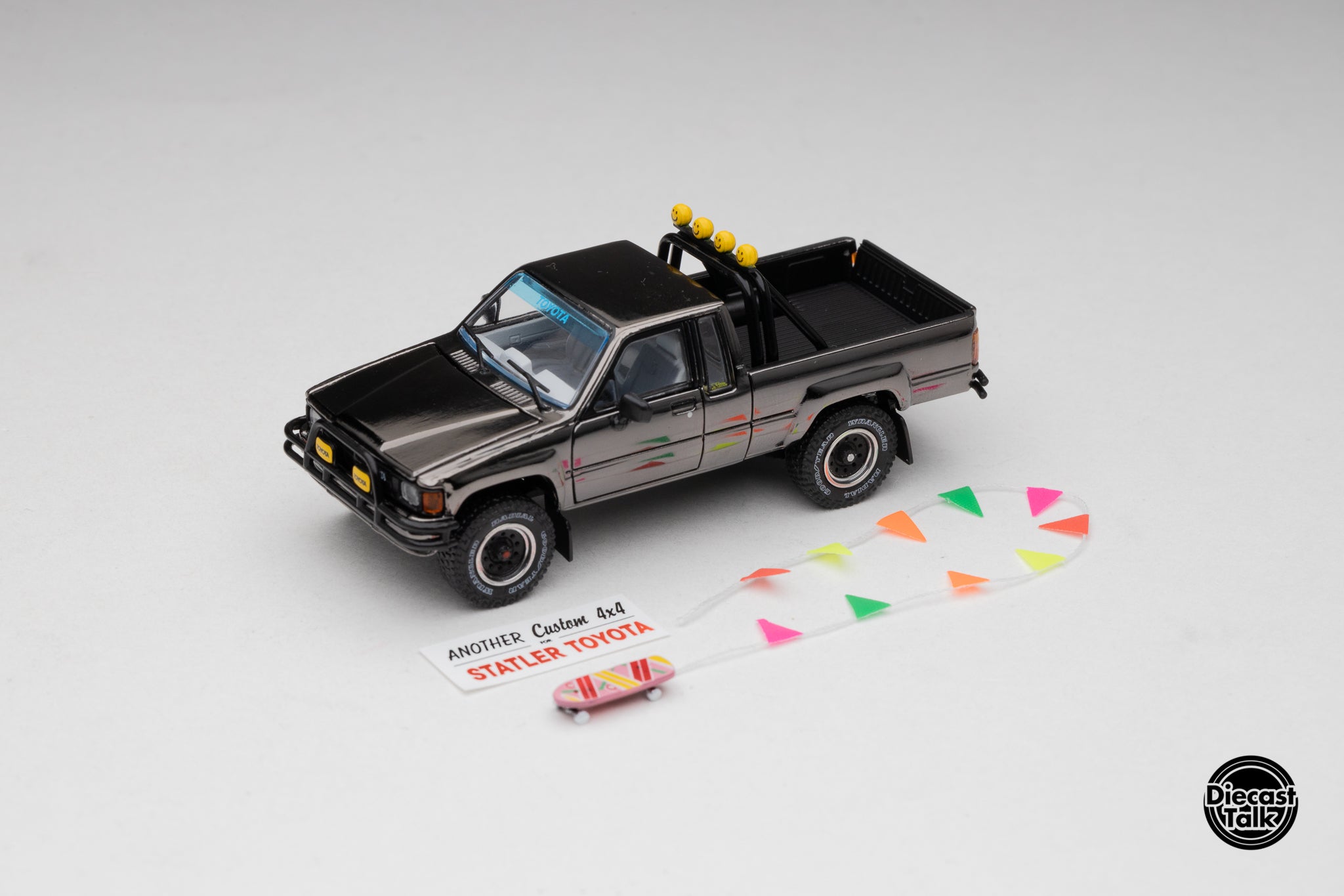 DiecastTalk MDX Exclusive 1/64 Toyota 1985 Hilux SR5 4x4 Black Chrome