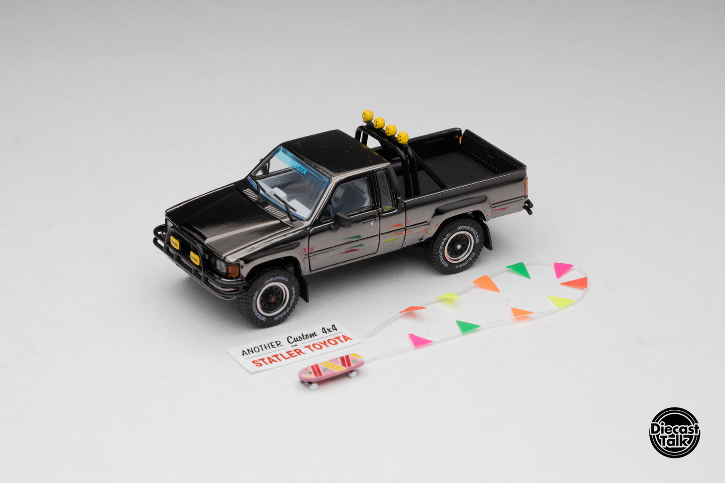 DiecastTalk MDX Exclusive 1/64 Toyota 1985 Hilux SR5 4x4 Black Chrome