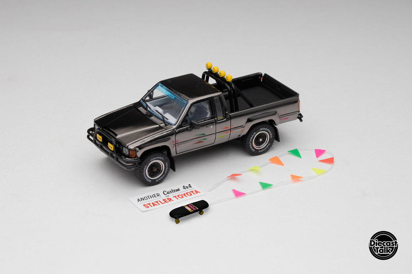 DiecastTalk MDX Exclusive 1/64 Toyota 1985 Hilux SR5 4x4 Black Chrome