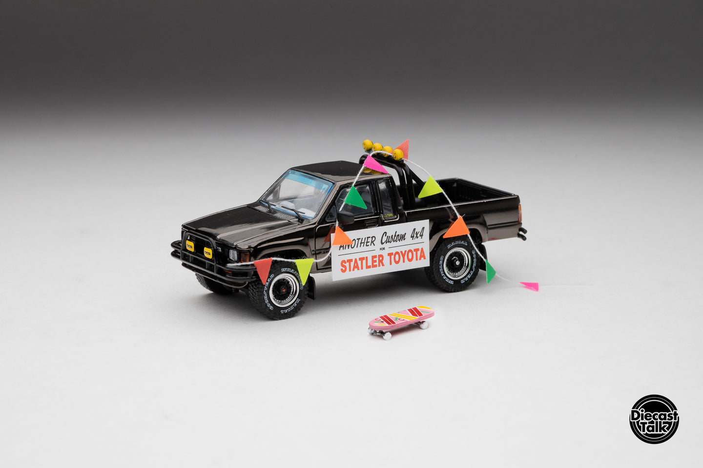 DiecastTalk MDX Exclusive 1/64 Toyota 1985 Hilux SR5 4x4 Black Chrome