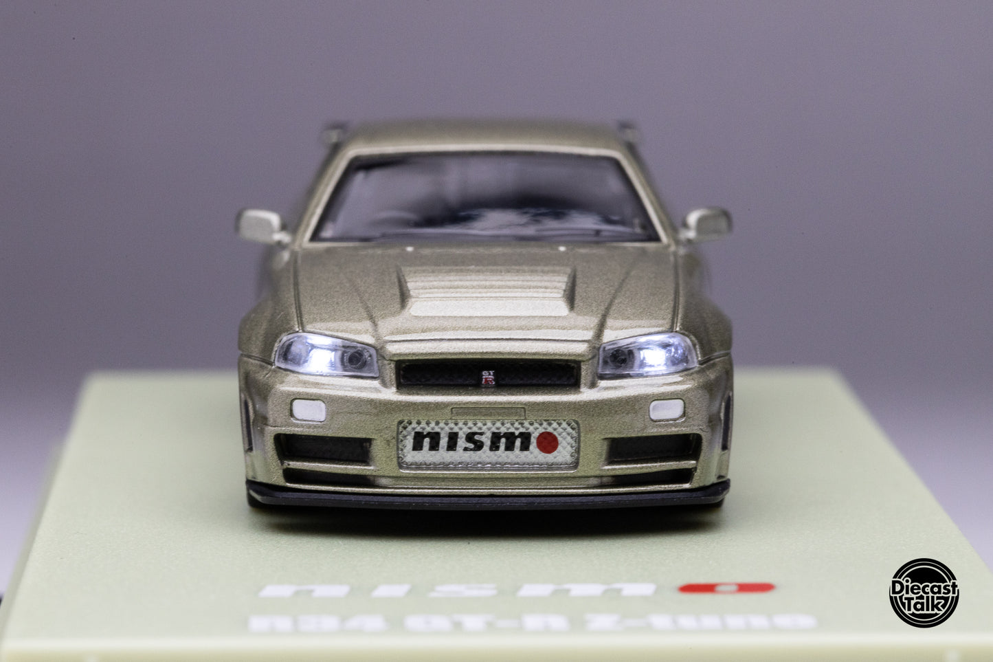 DiecastTalk Exclusive Kyosho 1/64 Nissan Skyline R34 GT-R Millenium Jade MOTN Compatible