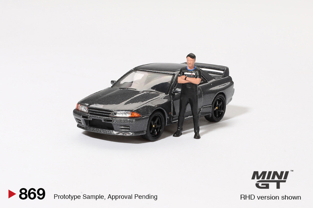 Mini GT 1:64 Nissan Skyline GT-R (R32) Nismo Gunmetal W/ Matsuda Figure