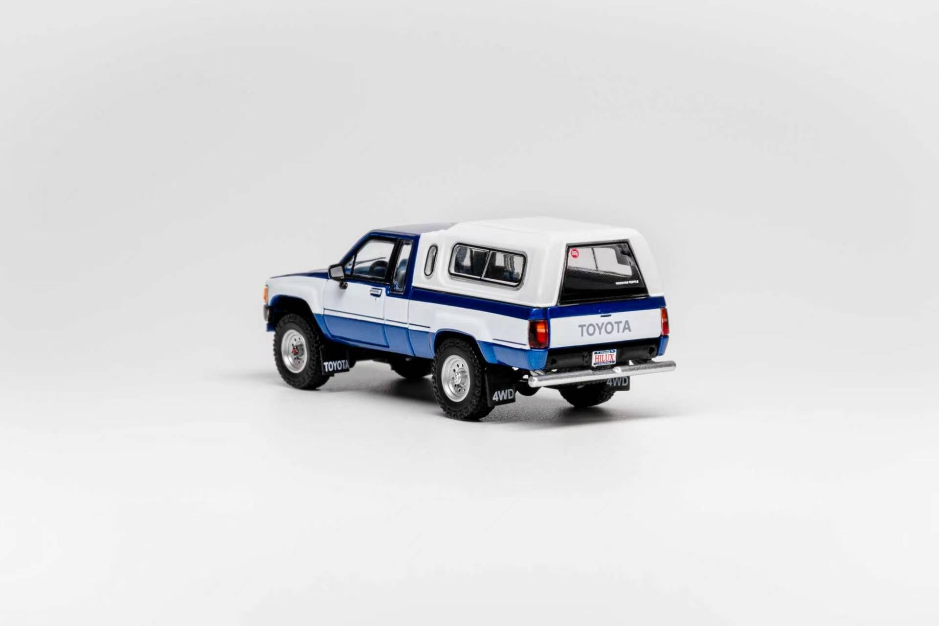 GCD 1:64 Toyota 1985 Hilux 4x4 SR5 Blue/White – DiecastTalk